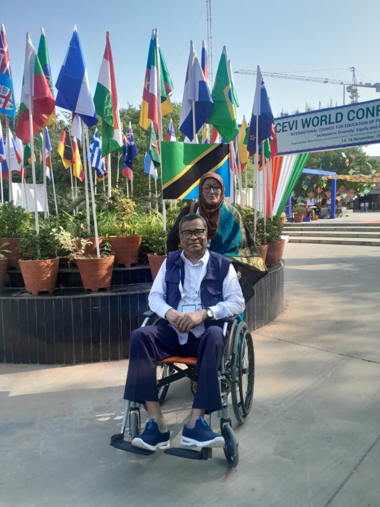 Mrs Ayesha Alam is moving wheelchair of Mr. Khandaker Jahurul Alam